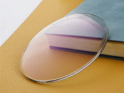 How do photochromic lenses adapt to light changes?