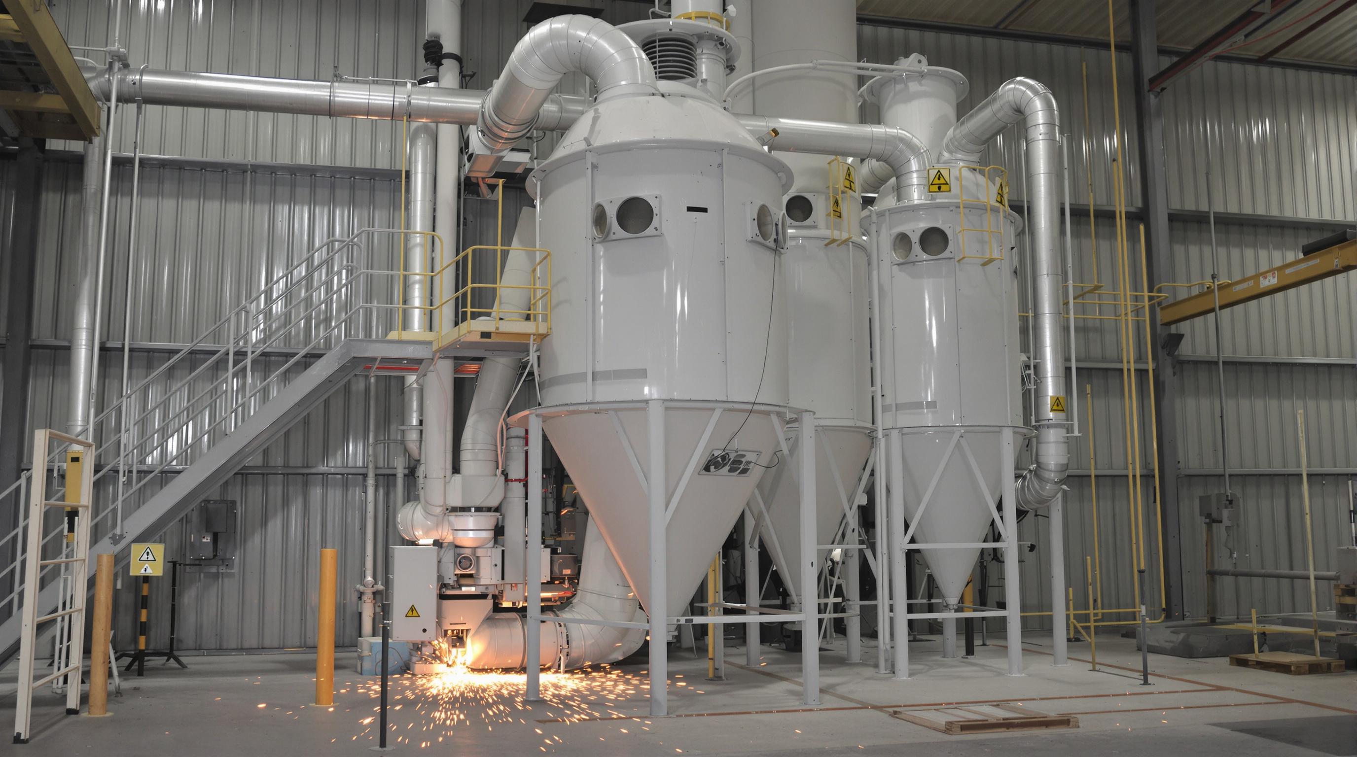 Dust collector system in a metal workshop preventing sparks from igniting hazardous dust
