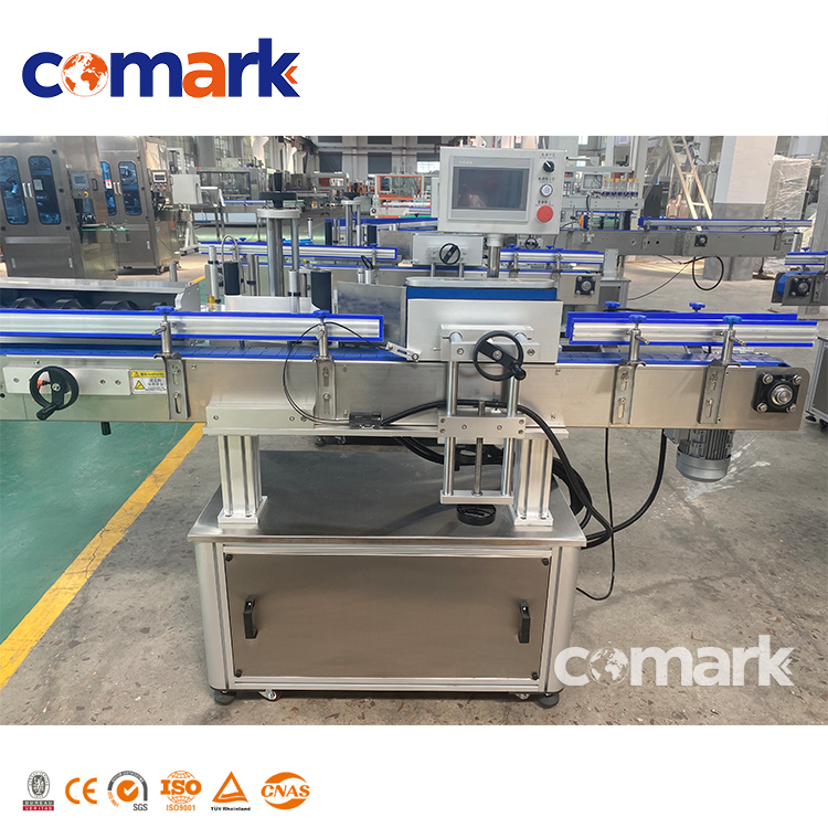 Màquina d'etiquetatge amb adhesiu