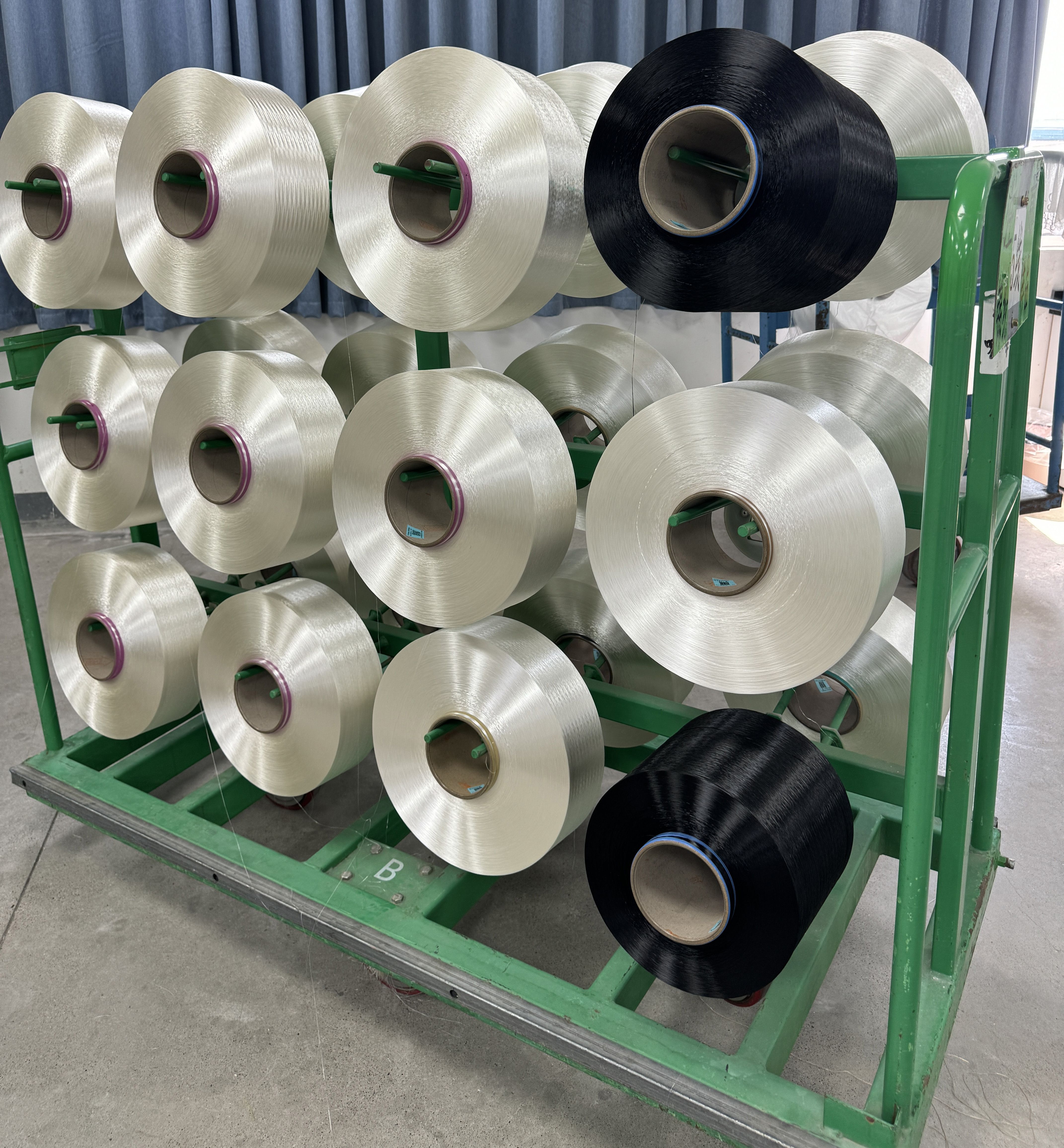 Where is the regenerated high strength low shrinkage polyester filament mainly used?