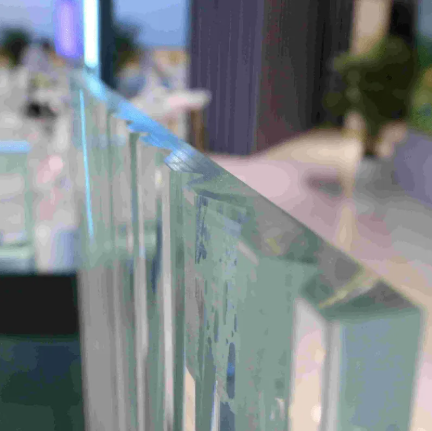 How is curved glass manufactured and shaped for construction projects?